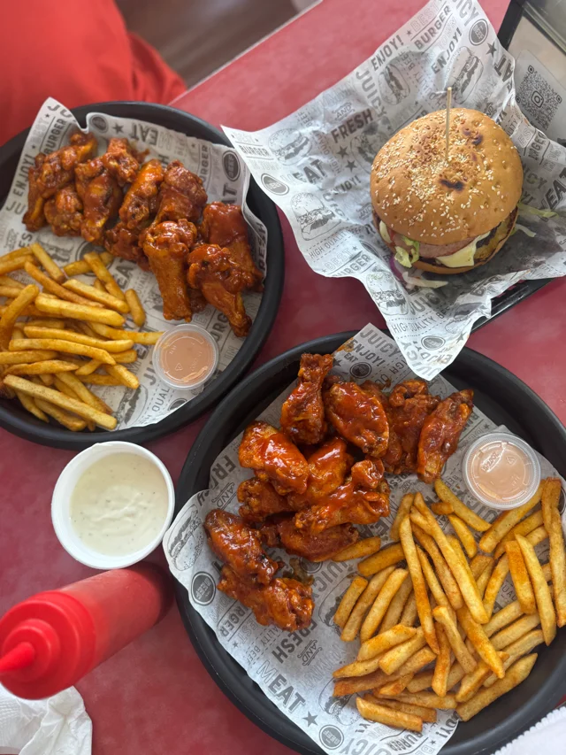 Boosted Burger wings with fries and dipping sauces